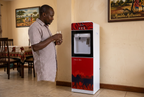 Red and black Sonar G5C dispenser in a Kenyan dining room
