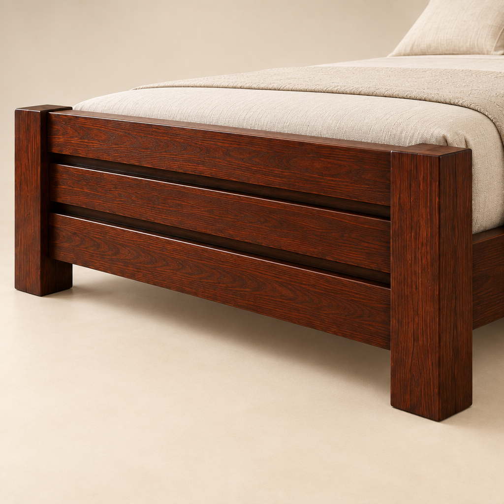 Close-up of the matching horizontal-slat mahogany footboard, square posts and wood grain