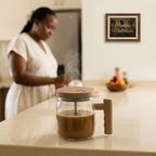 Beige self-stirring glass mug on a breakfast counter