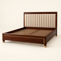 Vertical-channel upholstered solid mahogany bed in a clean studio