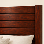 Close-up of the exact four horizontal mahogany headboard boards and square corner post