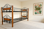 Wood and black steel double-decker bed in an ivory room with botanical artwork